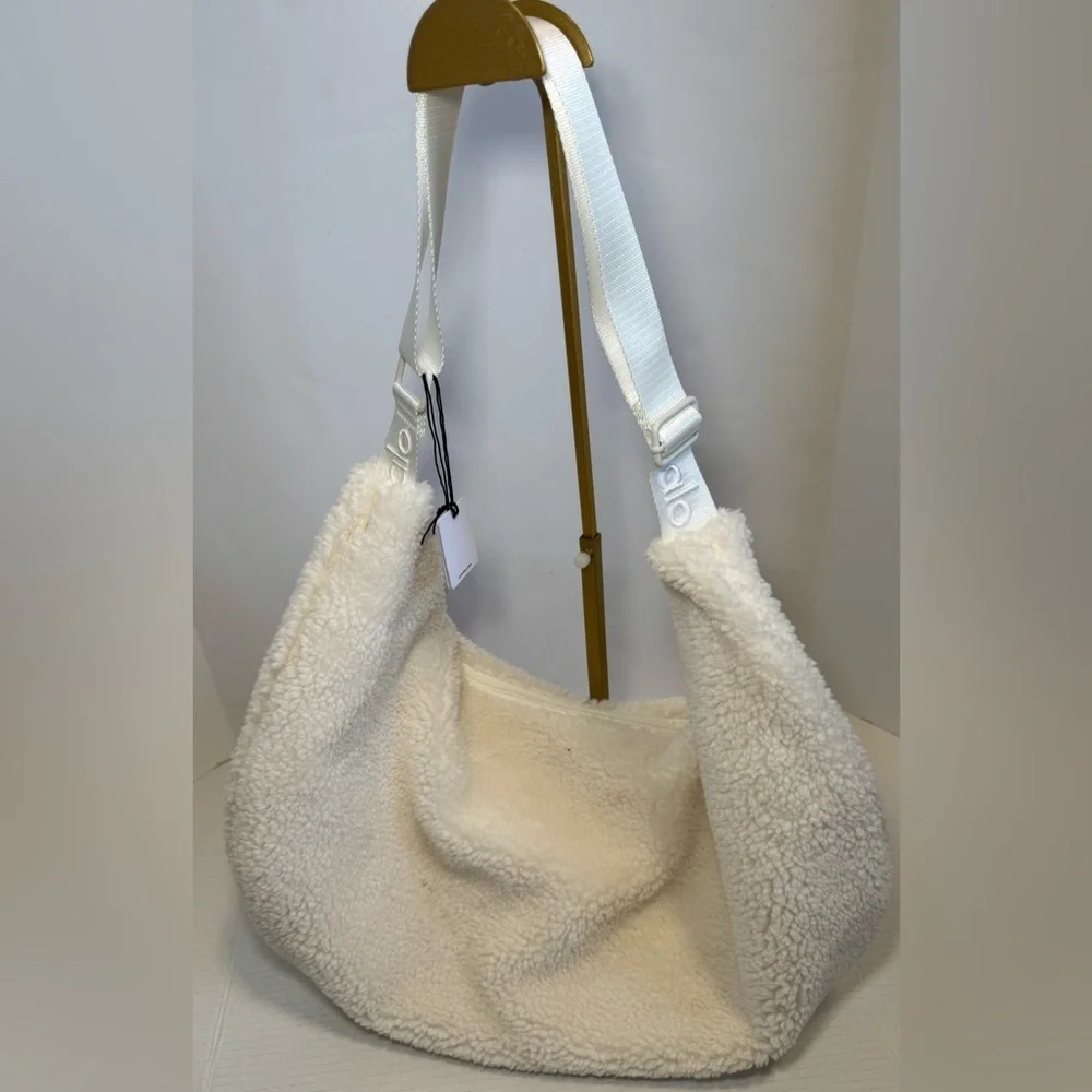Alo Yoga Sherpa On The Go Sling Bag in ivory
